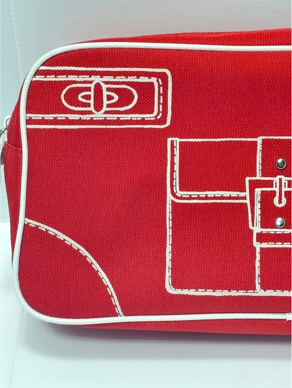 Clinique Red Canvas Cosmetic Bag with White Image Stitching and Zipper Closure